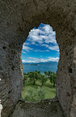 Fototapeta na wymiar Terme di Catullo, Sirmione, Italy. The complex of the so-called Grottoes (or Spas) of Catullo is located on the northern end of the Sirmione peninsula, on the southern coast of Lake Garda. From this p