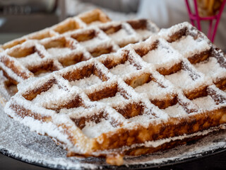 sweet waffle with powdered sugar background
