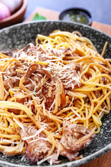 Plate with tasty pasta and mushrooms, closeup