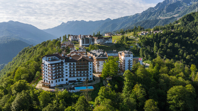 Rosa Khutor plateau, buildings, slopes and chair lifts. Aerial view at summer. Russia, Sochi, Krasnaya Polyana