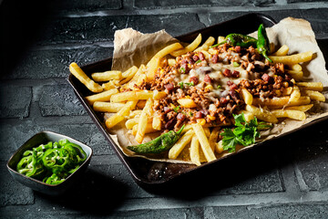 Golden crispy potato fries with beef mince