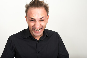 Obraz premium Portrait of crazy businessman with blond hair smiling