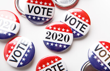 Voting poll concept with red, white and blue vote button pins