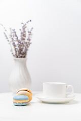 macarons on background Cup and vase with lavender.
