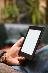 Senior man using an ebook reader