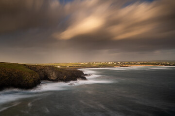 Trevose Head, Cornwall, UK. Long exposure of coastline and houses above cliff.