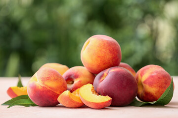 Ripe peaches on table in garden