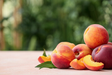 Ripe peaches on table in garden