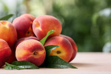 Ripe peaches on table in garden