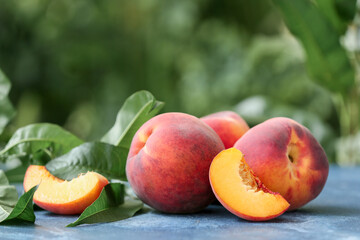 Ripe peaches on table in garden