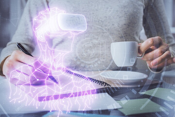AR hologram over woman's hands taking notes background. Concept of augmented reality. Multi exposure