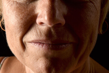 Obraz premium detail of the face of a fifty year old woman