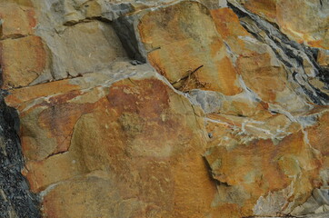 Rock layers - a colorful formations of rocks stacked over the hundreds of years. Interesting background with fascinating texture.
