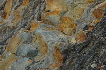 Rock layers - a colorful formations of rocks stacked over the hundreds of years. Interesting background with fascinating texture.