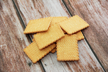 edible square dry cookies in a decorative plate