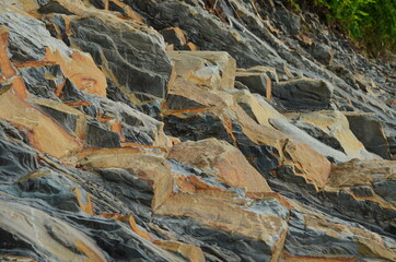 Rock layers - a colorful formations of rocks stacked over the hundreds of years. Interesting background with fascinating texture.