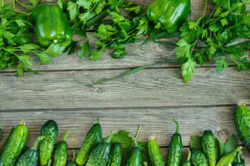 Framing of green vegetables on a wooden background