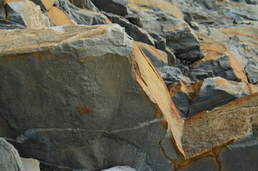 Rock layers - a colorful formations of rocks stacked over the hundreds of years. Interesting background with fascinating texture.