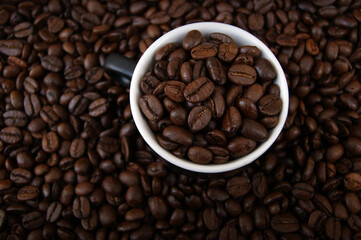 A cup filled with coffee grains.