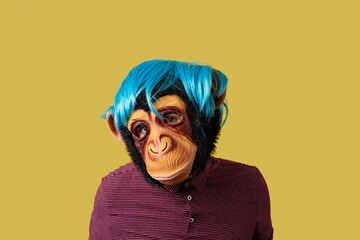 man wearing a monkey mask and a wig