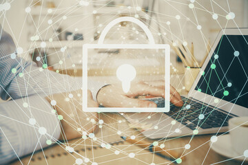 Double exposure of lock icon with man working on computer on background. Concept of network security.
