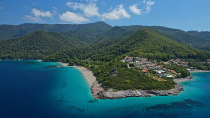 Obraz premium Aerial drone panoramic photo of famous turquoise paradise beach of Milia covered with pine trees, Skopelos island, Sporades, Greece