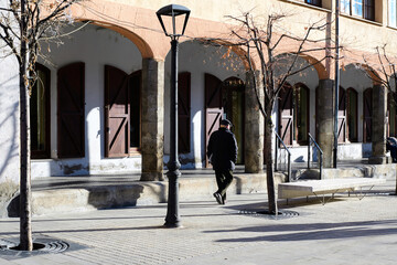Grandpa strolling through the streets of the town