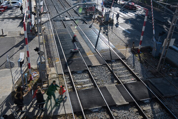cars crossing level close to train station