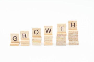 Wooden blocks as a step with the inscription GROWTH. Business concept.