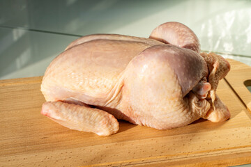 Fototapeta premium raw chicken on wooden board