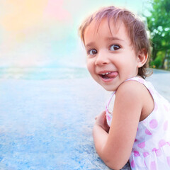 Closeup of cute laughing at camera. Funny girl shows her tongue. Square background, copy space