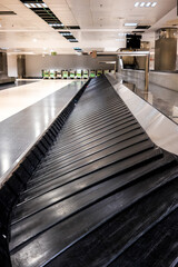 empty airport without nobody at the picture - travelling lifestyle concept - waiting the bags after the flight - empty airport for the covid-19 quarantine and lockdown