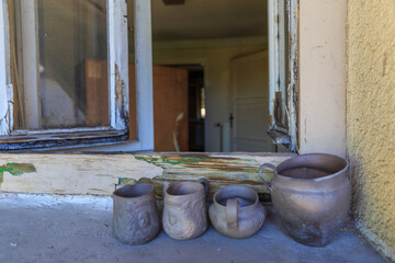 old clay pots on old window