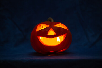 Scary halloween pumpkin for holiday on blue background