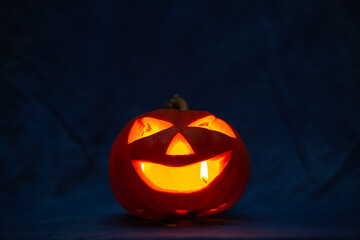 Scary halloween pumpkin for holiday on blue background