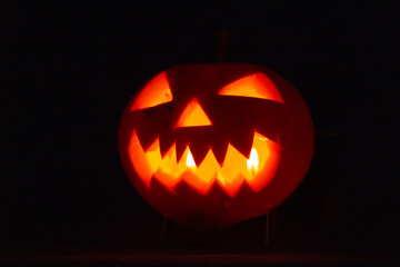 Scary halloween pumpkin for holiday on blue background