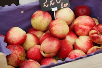 Juicy nectarines on the market close up