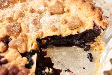 Delicious blueberry pie on the table macro
