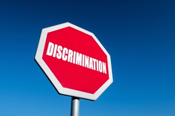 Stop sign as a symbol to cease discrimination in society because of race, gender, sexuality or other reasons