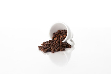 Coffee roasted beans in a white coffee cup