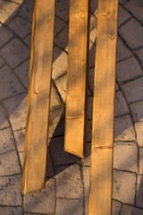 Long wooden piles standing on the ground prepared for construction