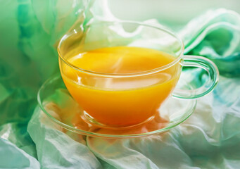 Sea buckthorn tea in transparent cup