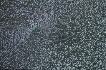 broken glass window cracked pattern vandalism crash close-up impact wave