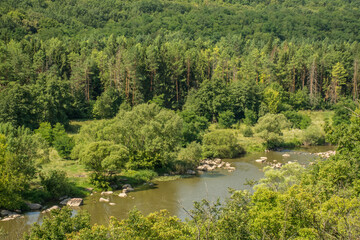 Fototapeta na wymiar Beautiful summer landscape of green nature. Forest, river and hills