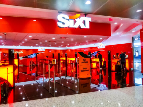 Miami, Florida, USA - November 29, 2019: The people near Sixt rental car office at Miami airport