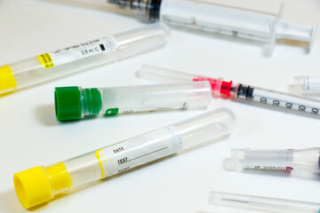 Blood test empty tubes samples on the white background, studio shoot.