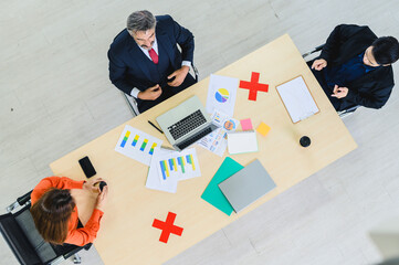 Business office people maintain social distancing meeting room. Stop covid-19 coronavirus. New normal lifestyle in job.