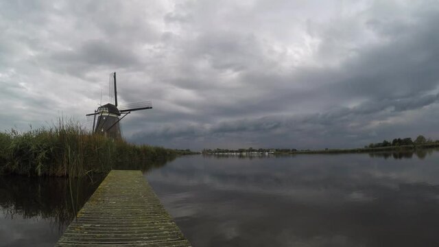 Time lapse of an arcus cloud of a thunderstorm over windmill near lake Rottemeren in The Netherlands