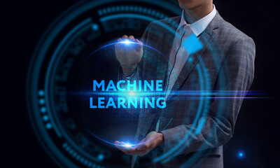Business, Technology, Internet and network concept. Young businessman working on a virtual screen of the future and sees the inscription: Machine learning