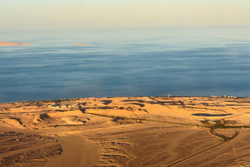 Aerial view on arabian desert and Red sea from the airplane